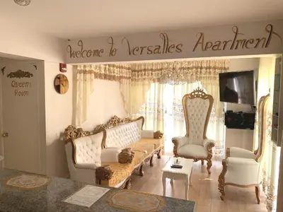 a living room with a couch and two chairs at VERSALLES APARTMENT in Lima