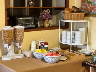 a counter with bowls of food on a table at Eco Inn in Cusco