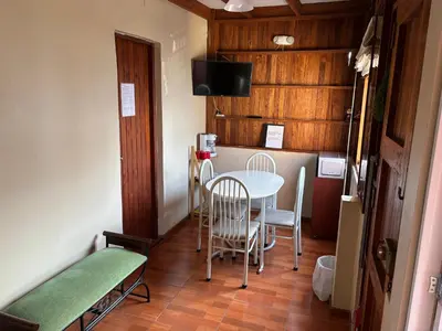 a small dining room with a table and chairs at Apartamento zona histórica Barranco Desayuno incluido in Lima
