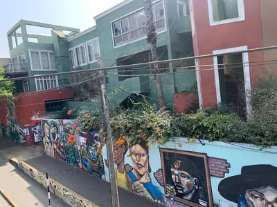 a building with paintings on the side of it at Apartamento zona histórica Barranco Desayuno incluido in Lima