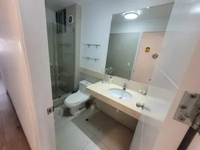 a bathroom with a toilet and a sink and a shower at Espacio Luxury Apartments - Malecón 28 de Julio. in Lima