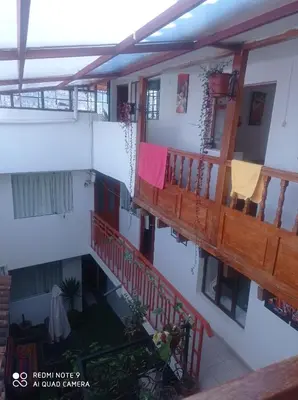 an overhead view of a building with two balconies at Hostel mágico San Blas in Cusco