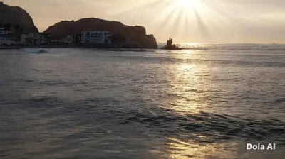 a view of the ocean with the sun setting at Departamentos Cerro Azul P2 in Cerro Azul
