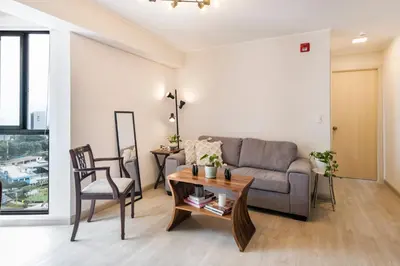 a living room with a couch and a table at Barranco inolvidable BR1 in Lima