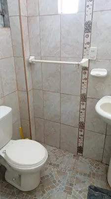 a bathroom with a toilet and a sink at Casa 1er piso D&C in Huancayo