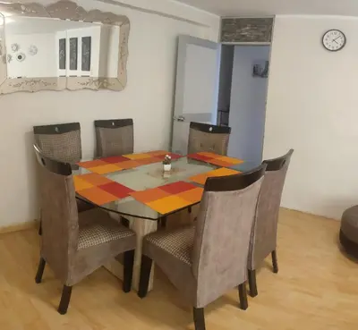 a dining room with a table and chairs at Casa 1er piso D&C in Huancayo