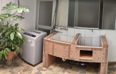 a bathroom with a sink and a trash can at Casa 1er piso D&C in Huancayo