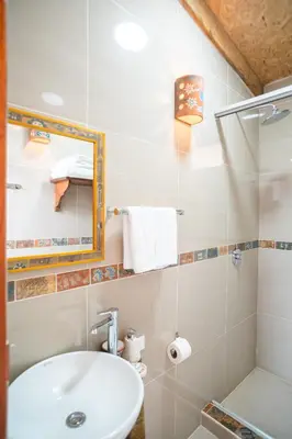 a bathroom with a sink and a shower at Stardome Spiritual Experience in Ollantaytambo