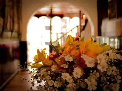 a bouquet of flowers sitting on top of a table at Hotel Santa Maria in Cusco