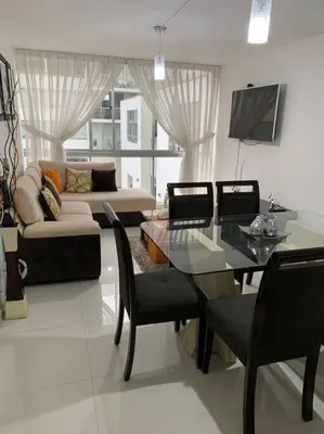 a living room with a glass table and a couch at Lovely two bedroom apartment in Miraflores in Lima