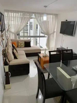 a living room with a couch and a table at Lovely two bedroom apartment in Miraflores in Lima