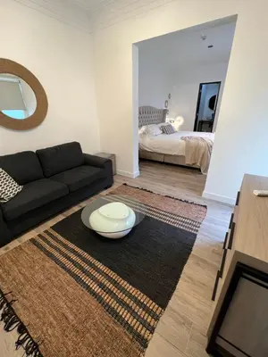 a living room with a couch and a table at WasiPai Boutique Hotel in Lima