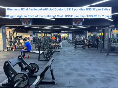 a gym with treadmills and bikes in a building at ALU Apartments - Miraflores in Lima
