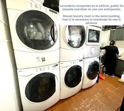 three washing machines stacked on top of each other at ALU Apartments - Miraflores in Lima