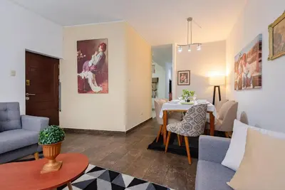 a living room with a couch and a table at Sweet MATERNITY Home & 3 dormitorios, AIRE ACONDICIONADO in Lima