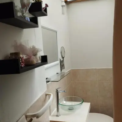 a bathroom with a glass bowl on a sink at Barranco monumental in Lima
