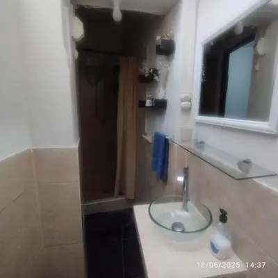 a bathroom with a sink and a mirror at Barranco monumental in Lima