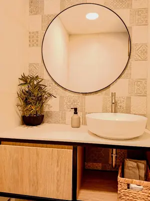 a bathroom with a sink and a mirror at Vistamar Duplex in Lima