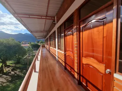a train station corridor with a view of the mountains at Pampa Bella Lodge in La Merced
