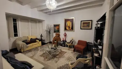 a living room with a teddy bear sitting on a table at La Casona Hospedaje in Lima