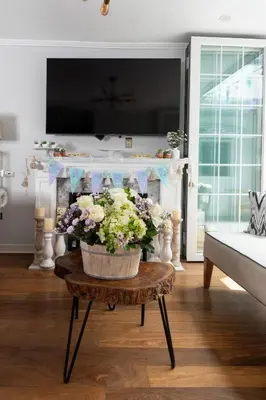 a vase of flowers on a table in a living room at Casa Ramos Salamanca - Airport pick up and drop off service - Homestay in Lima