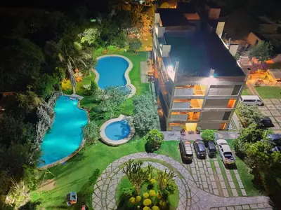 an overhead view of two swimming pools in a yard at Hotel Rumi Wasi in Lunahuaná