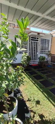 a house with some plants in front of it at Casa Club Vacacional in Ica
