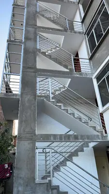 a building with stairs on the side of it at Casa Galarza in Huancayo