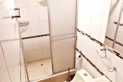a bathroom with a shower and a toilet at Depawanka 1 departamento amoblado in Huancayo