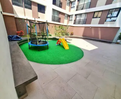 a playground in a courtyard of a building at Apartamento estreno céntrico y moderno in Lima