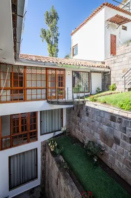 an external view of a house with a yard at Mamasara Cusco in Cusco