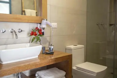 a bathroom with a sink and a toilet at Abittare Hotel in Cusco
