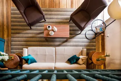 a living room with a couch and a table at Abittare Hotel in Cusco