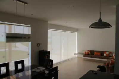a living room with a couch and a table at Casa 33 Sotavento Paracas in Paracas