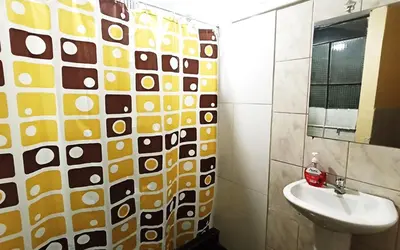 a bathroom with a sink and a mirror at Casa Sucre Hostel Ayacucho in Ayacucho
