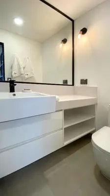 a bathroom with a white sink and a mirror at Navarrete by Wynwood House in Lima