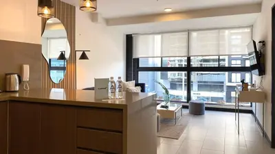 a kitchen with a counter and a large window at Navarrete by Wynwood House in Lima