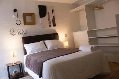 a bedroom with a large bed in a room at Beautiful apartment Near airport /cozy Oceanfront in Lima