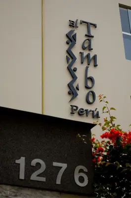 a sign on the side of a building at El Tambo 1 in Lima