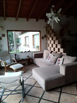 a living room with a couch and a table at Casa El Palto in Santa Eulalia