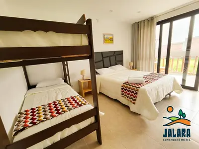 a bedroom with two bunk beds at Jalara hotel Boutique Lunahuaná in Lunahuaná
