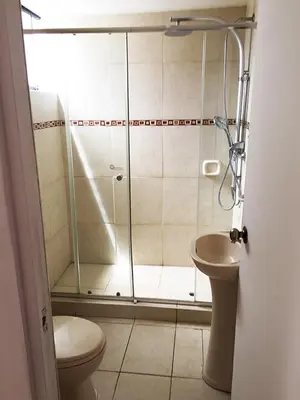 a bathroom with a shower with a toilet and a sink at IV Hermosa Habitacion Privada en Miraflores City in Lima