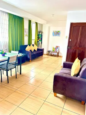 a living room with a couch and a table at IV Hermosa Habitacion Privada en Miraflores City in Lima