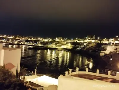 a view of a river at night with buildings at Minidepartamento en San Bartolo - VISTA AL MAR in San Bartolo