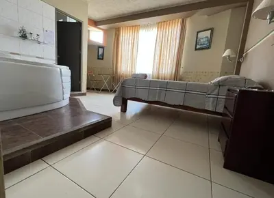 a living room with a bed and a couch at Hotel los angeles in Huaral