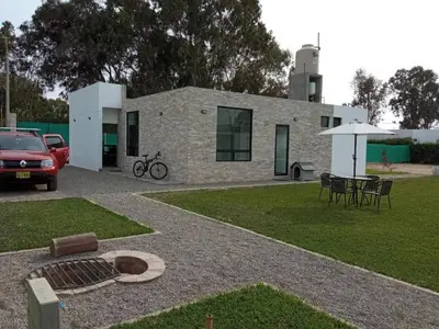 a house with a car parked in front of it at Country House In Asia in Asia