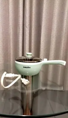a slow cooker on a glass table in front of a curtain at Gorgeous Private Studio LIMA-Own Bathroom-Near Airport in Lima