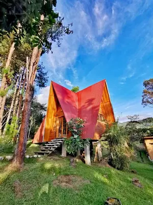 a house with a red roof at Oxablues Home Lodge in Oxapampa