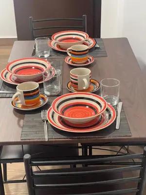 a table with plates and cups on it with at 19 Departamento en el centro de Miraflores in Lima