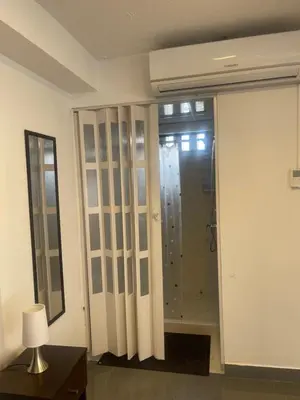 a bathroom with a shower and a glass door at 15 Acogedor dpto de un ambiente en miraflores in Lima